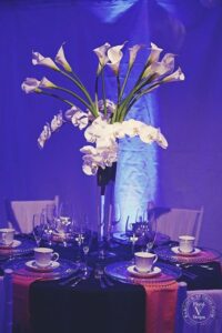 tall white wedding centerpiece with orchids 