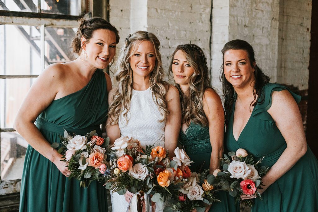 Bride with Bridesmaids and their Flowers
