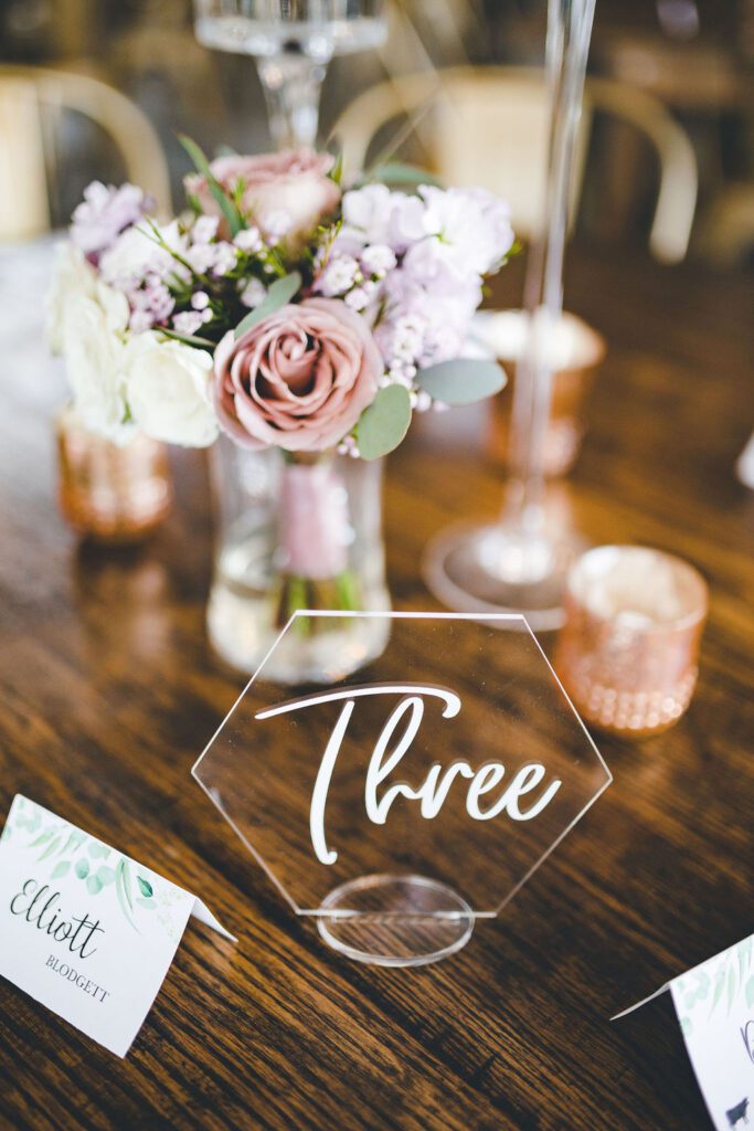 table number centerpiece bridesmaid bouquet flowers fall colors dusty pink dust purple glamorous industrial venue floral v designs 