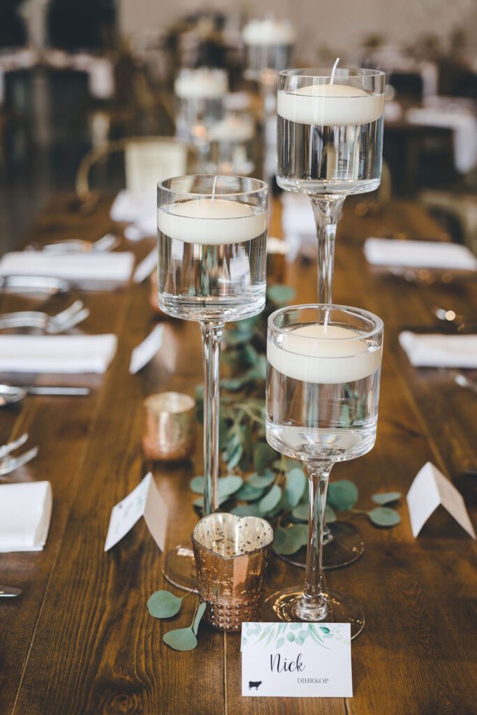 centerpiece floating candles gold votives glass greenery fall colors dusty pink dust purple glamorous industrial venue floral v designs 