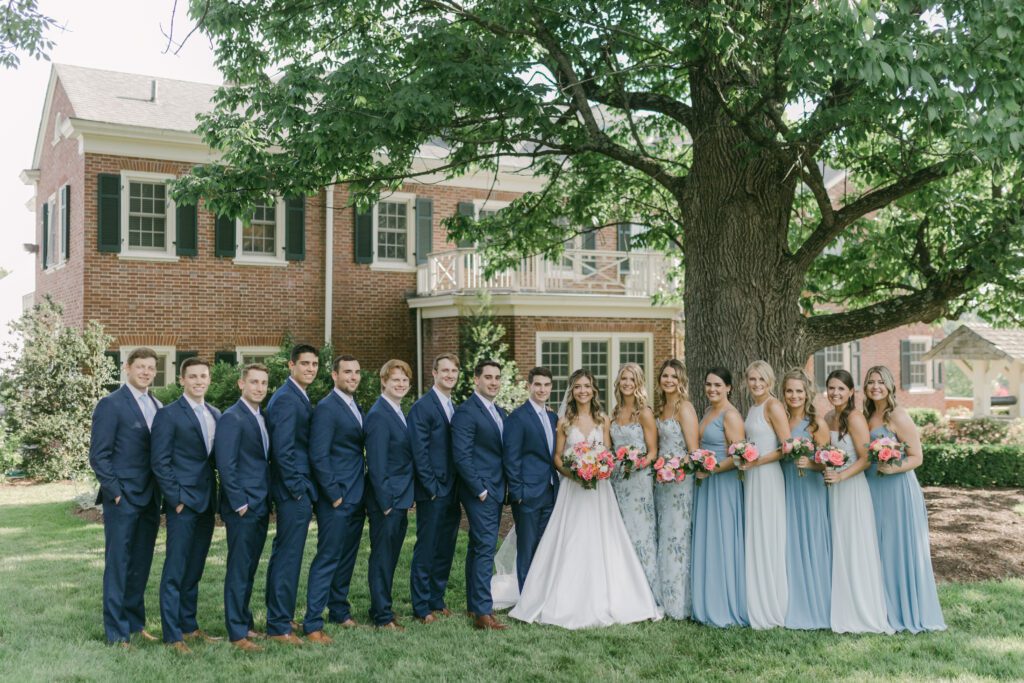 Dusty blue bridesmaids dresses in a spring wedding at French House in Cincinnati, Ohio with wedding flowers