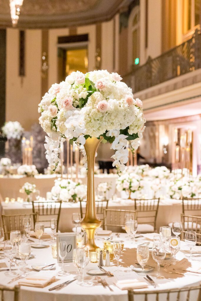 Tall wedding flower centerpiece on gold vase at the Hilton Netherland Plaza Cincinnati, Ohio